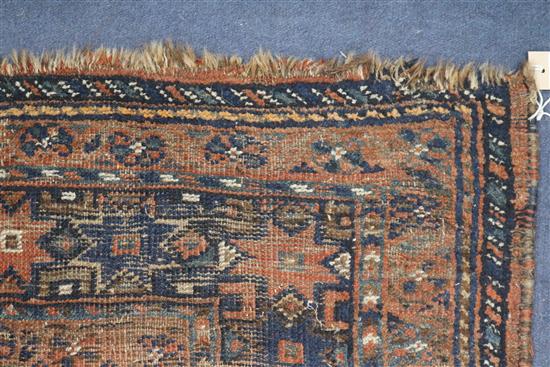 A Shiraz rug, a Bokhara saddlecloth and another rug (wear)